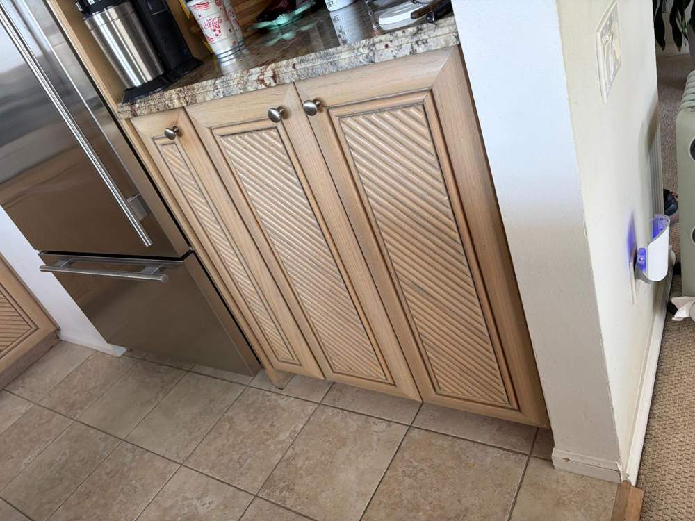 Lower cabinets beside dishwasher